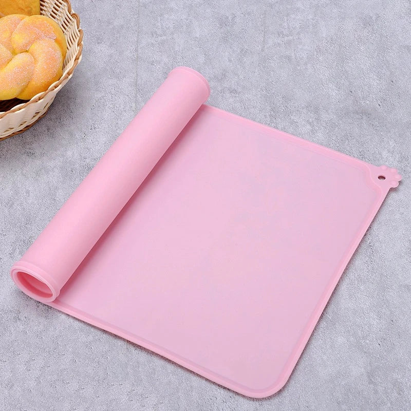 Pink silicone mat on a textured surface