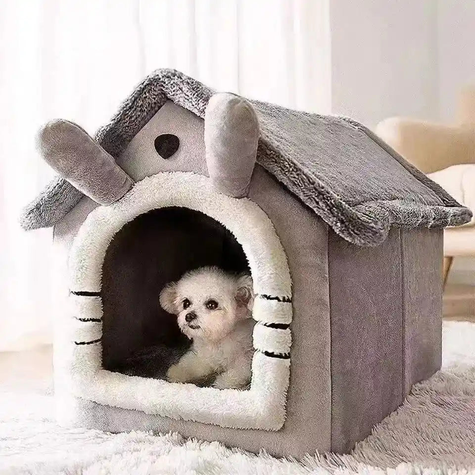 Gray soft dog bed house with plush entrance and roof.