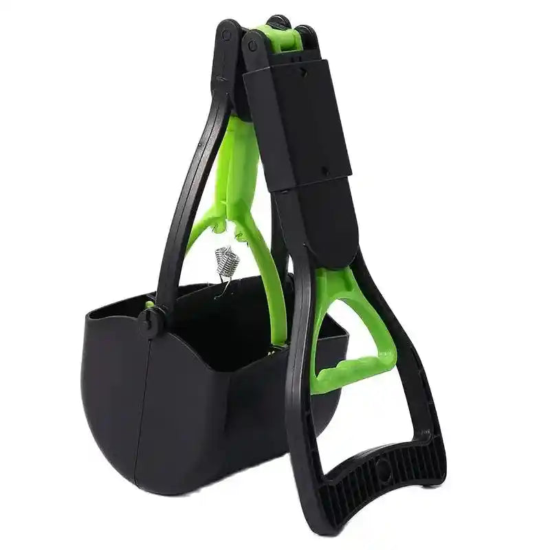 Green pooper scooper with spring mechanism