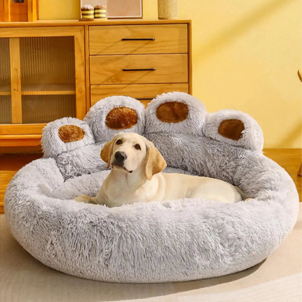 Gray plush dog sofa bed with Labrador resting