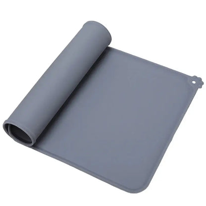 Gray silicone dog cat bowl mat rolled up