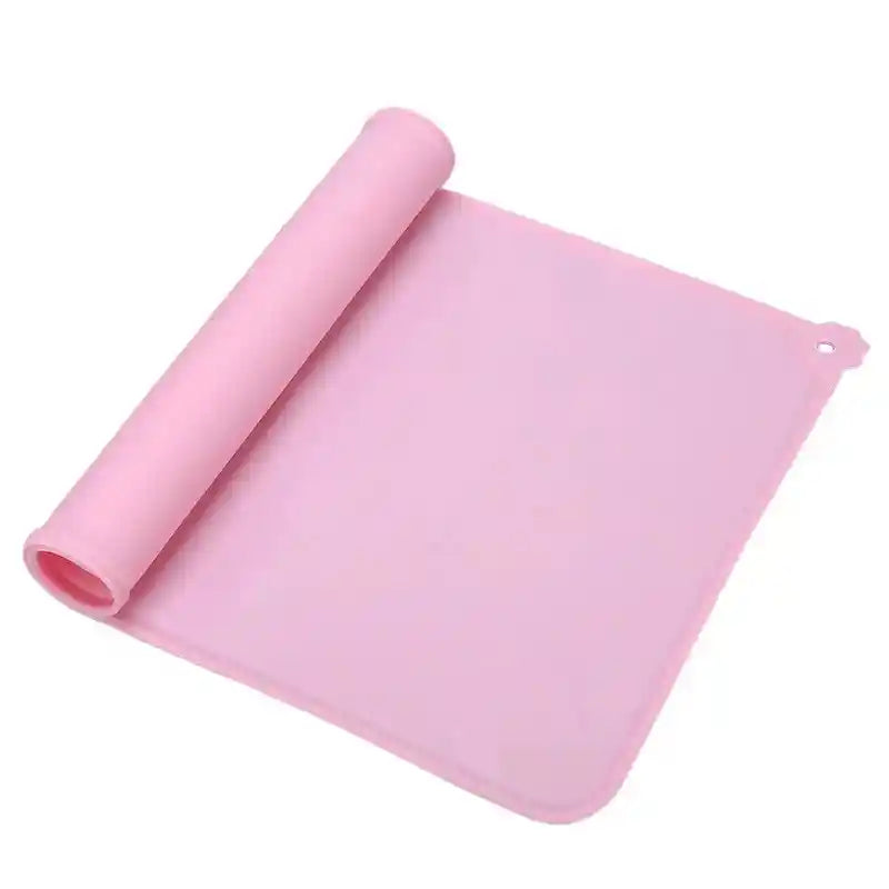 Pink silicone dog cat bowl mat rolled up